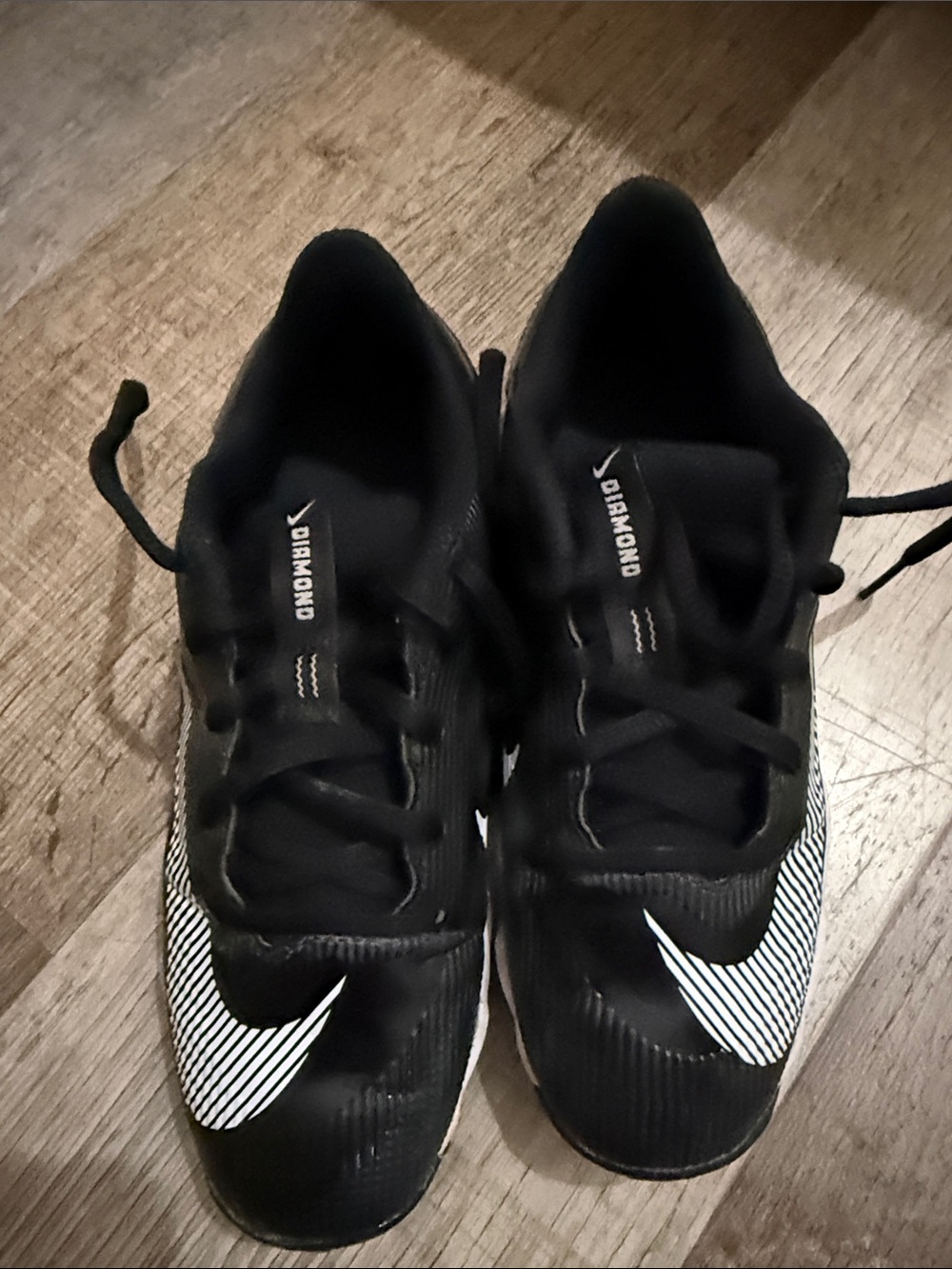 Nike Black Cleats with White Striped Swoosh